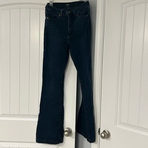Women’s super high-rise, dark wash flare jeans.